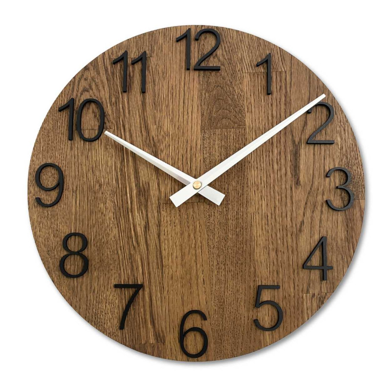Wooden wall clock with a circular shape and a subtle natural motif.