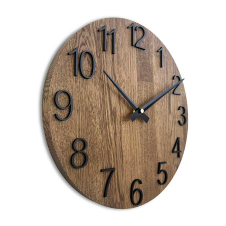 Wooden wall clock with a circular shape and a subtle natural motif.