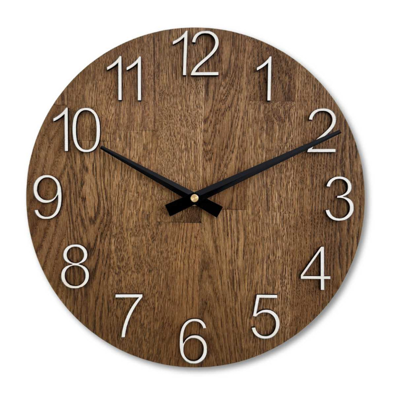 Wooden wall clock with a circular shape and a subtle natural motif.