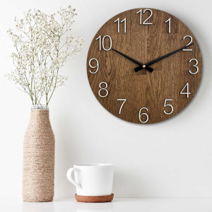 Natural wooden clock with a simple design and thin hands. 2