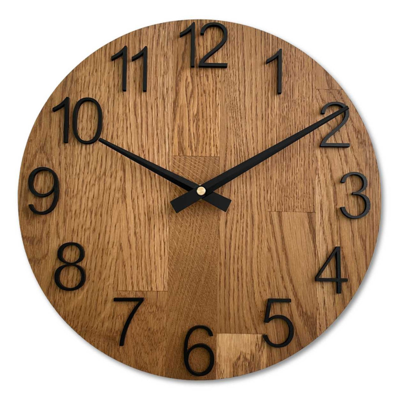 Carved wooden clock with a simple dial and minimalist design.