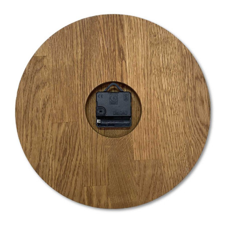 Carved wooden clock with a simple dial and minimalist design.