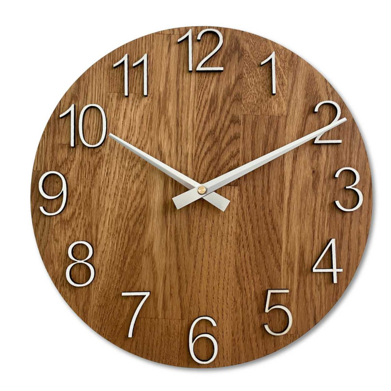 Wooden wall clock with a circular shape and a subtle natural motif.