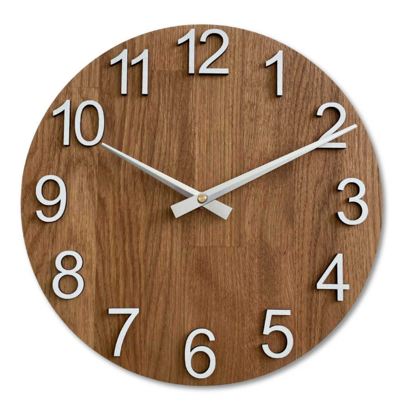 Carved wooden clock with a simple dial and minimalist design.