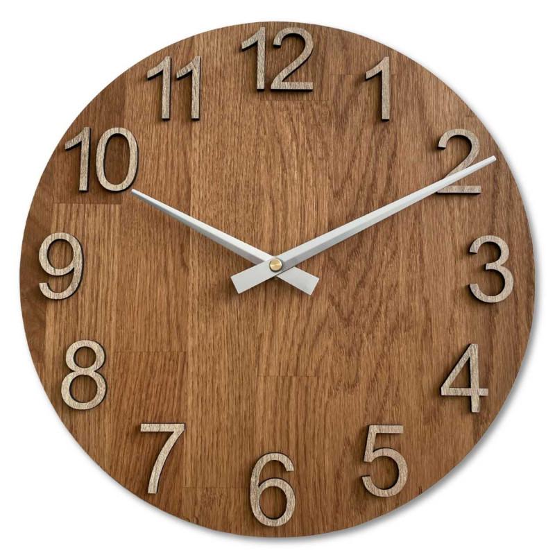 Carved wooden clock with a simple dial and minimalist design.