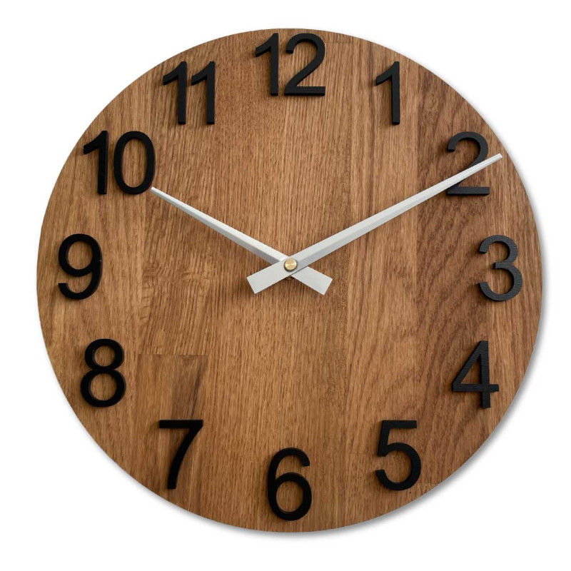 Carved wooden clock with a simple dial and minimalist design.