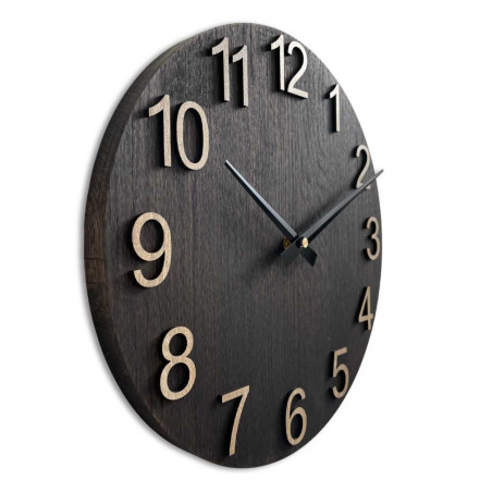 Modern wooden clock with a round shape and a discreet dial