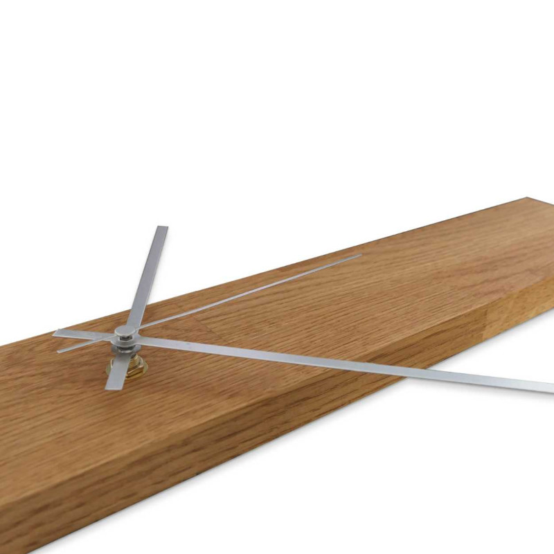 Wooden wall clock with a vertical shape and alternating black and silver hands.