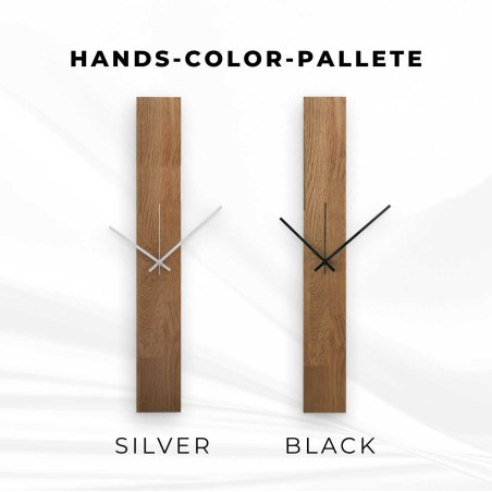 Narrow tall wooden wall clock in a rectangular shape with black hands