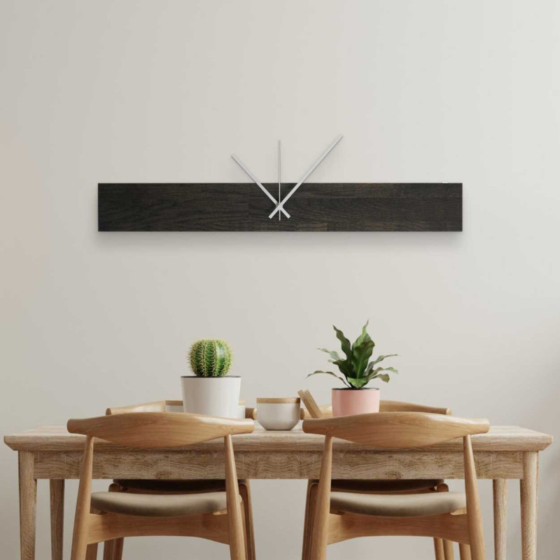 Modern wooden wall clock with an elegant silhouette.