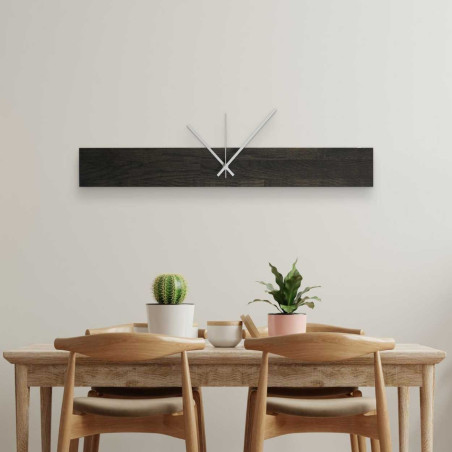 Modern wooden wall clock with an elegant silhouette.