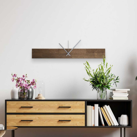 Wooden wall clock with a narrow rectangular shape and black hands