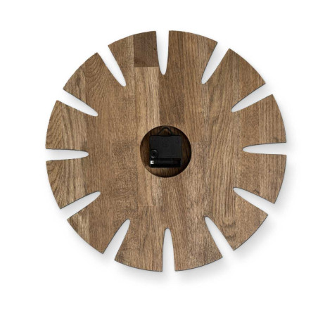 Elegant carved wooden wall clock with an original design suitable for the kitchen. Elegant carved wooden wall clock with an original design suitable for the kitchen.