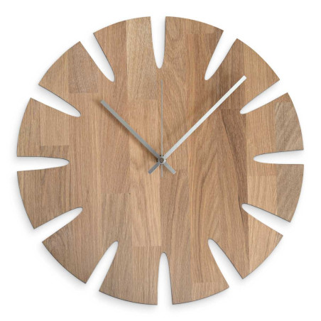 Luxurious wall clock in a modern wooden design for a stylish apartment. Luxurious wall clock in a modern wooden design for a stylish apartment.