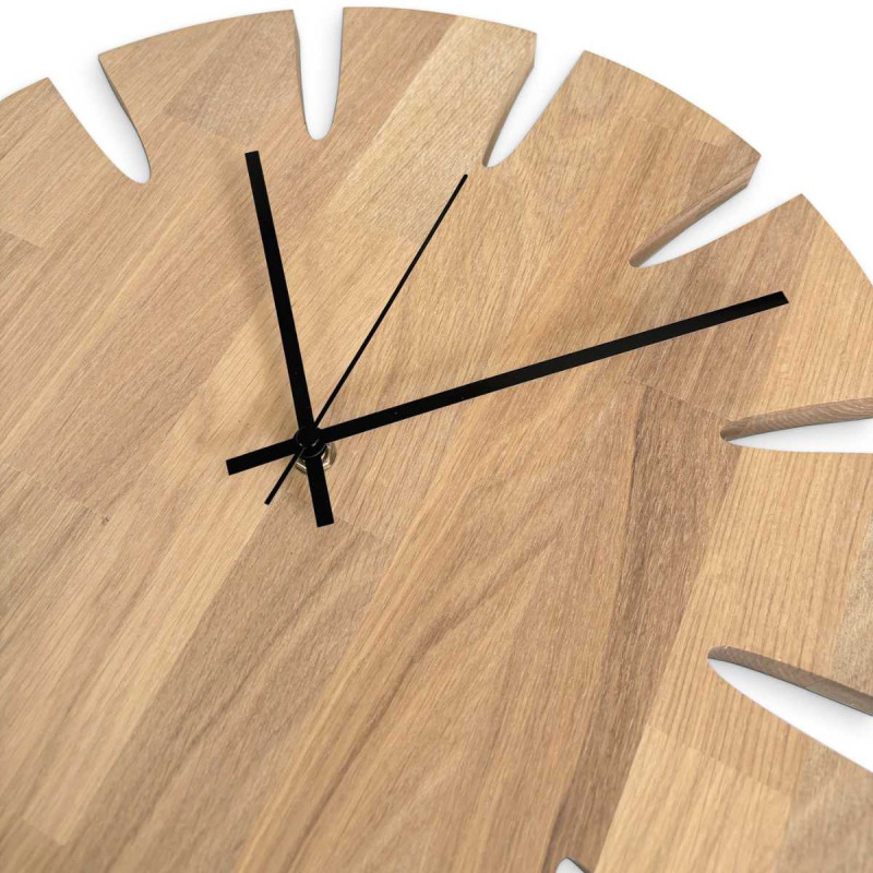 Designer wooden clock with a stylish motif for a modern interior.