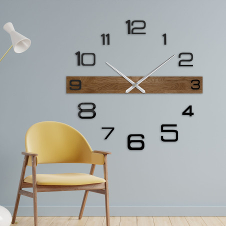 Luxurious wooden clock with a dark wooden frame and black plastic numerals. Luxurious wooden clock with a dark wooden frame and black plastic numerals.