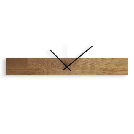 Modern and inexpensive wooden clock with dark hands and black separate digits. Modern and inexpensive wooden clock with dark hands and black separate digits.