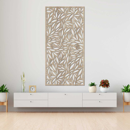 Decorative panel with leaf cutouts on a light wall