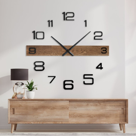 Modern wall clock with a wooden center bar and black, separate digits. Modern wall clock with a wooden center bar and black, separate digits.