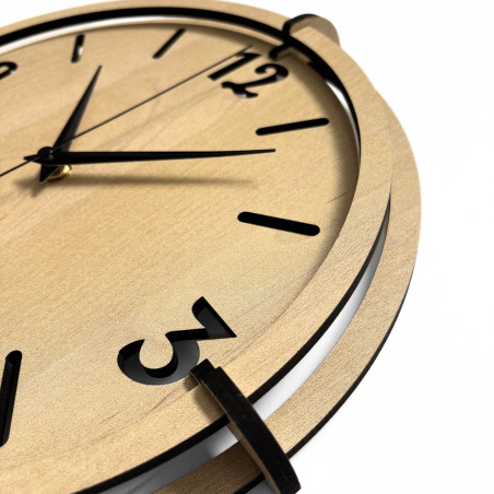 Modern wooden wall clock with plastic 3D numbers and a distinctive frame in a natural decor.