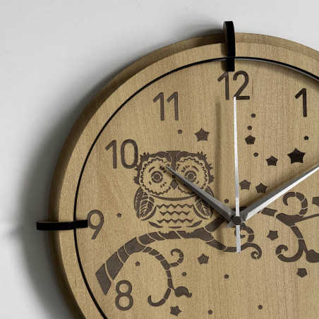 Children's owl wall clock made of maple wood brings peace and playfulness.