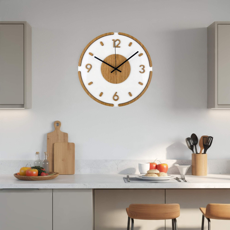 Minimalist wall clock with a white dial and distinctive silver hands.