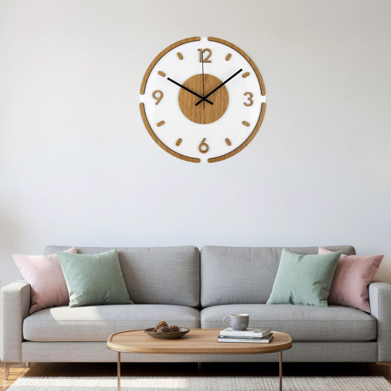 Minimalist wall clock with a white dial and distinctive silver hands.
