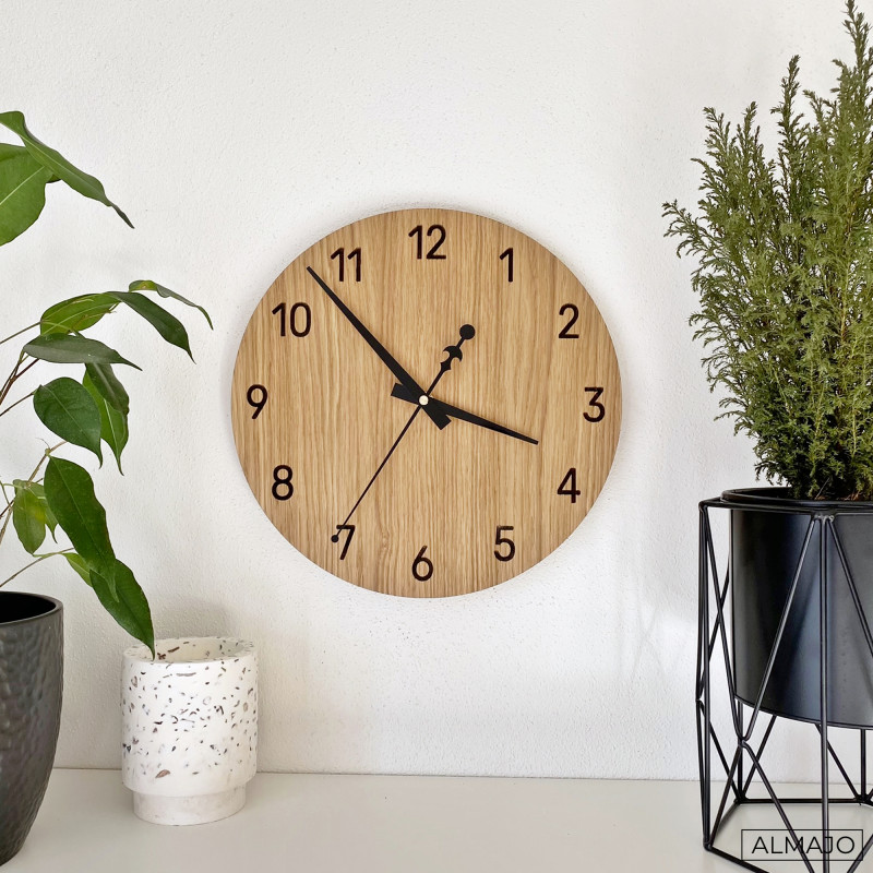 Modern wall clocks made of high-quality oak plywood are an elegant and timeless addition to any interior.