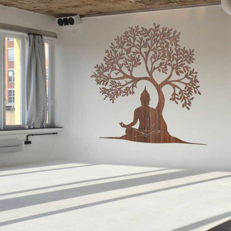 Wooden tree of life with a peaceful Buddha silhouette