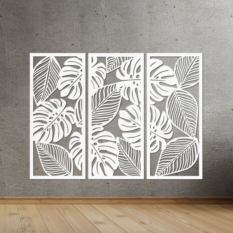 Modern wall decoration: three panels with cutouts of monstera leaves.