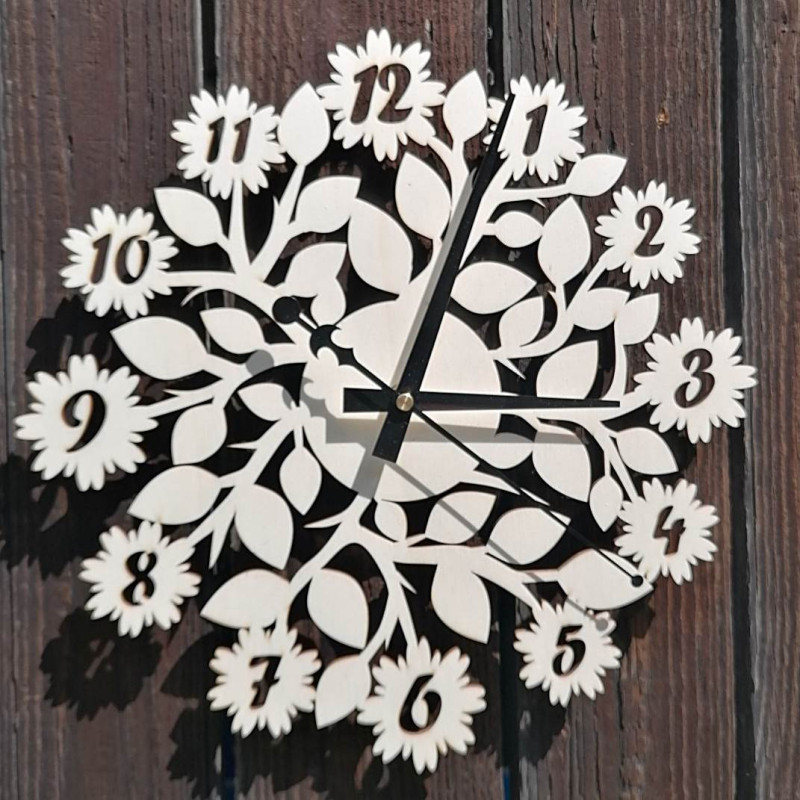 Elegant wooden clock with silent operation and a delicate floral motif.