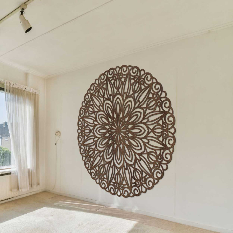 Carved wooden mandala on the wall, flower of...
