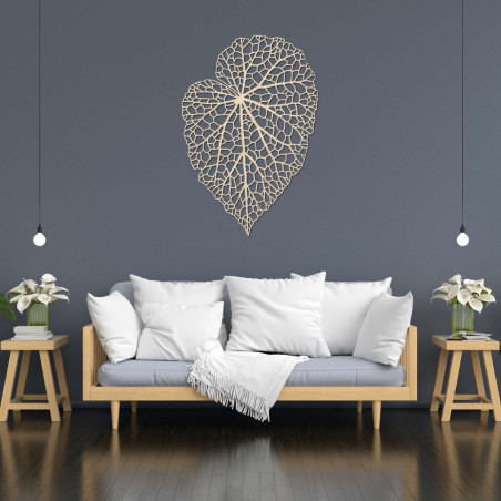 A designer wooden picture with a leaf detail for tasteful and cozy living