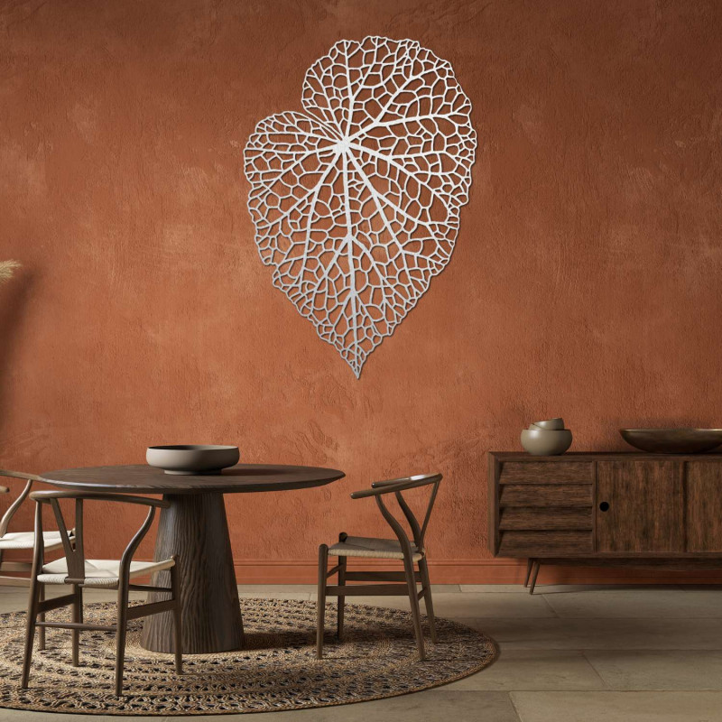 A designer wooden picture with a leaf detail for tasteful and cozy living