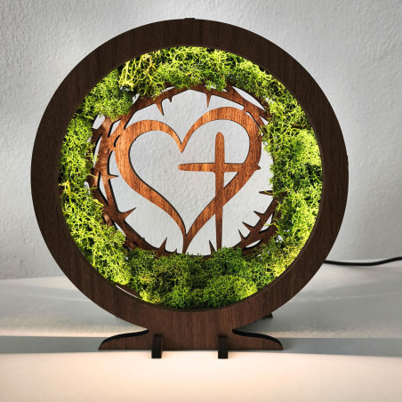 Stylish decoration with a spiritual motif. LED lamp with moss in an elegant walnut decor.