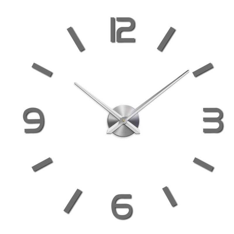 Wall clock with mirror elements in silver color on the wall in the interior