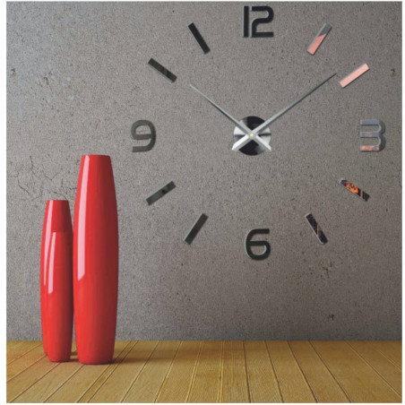 Wall clock with mirror elements in silver color on the wall in the interior