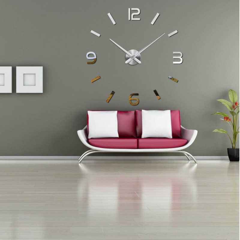 Wall clock with mirror elements in silver color on the wall in the interior
