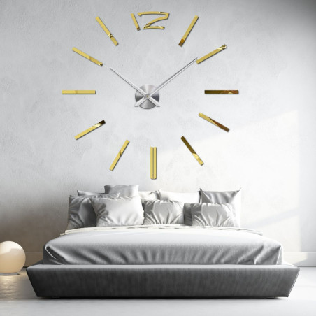 Modern wall clock in gold for an elegant bedroom