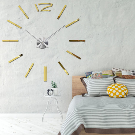 Modern wall clock in gold for an elegant bedroom
