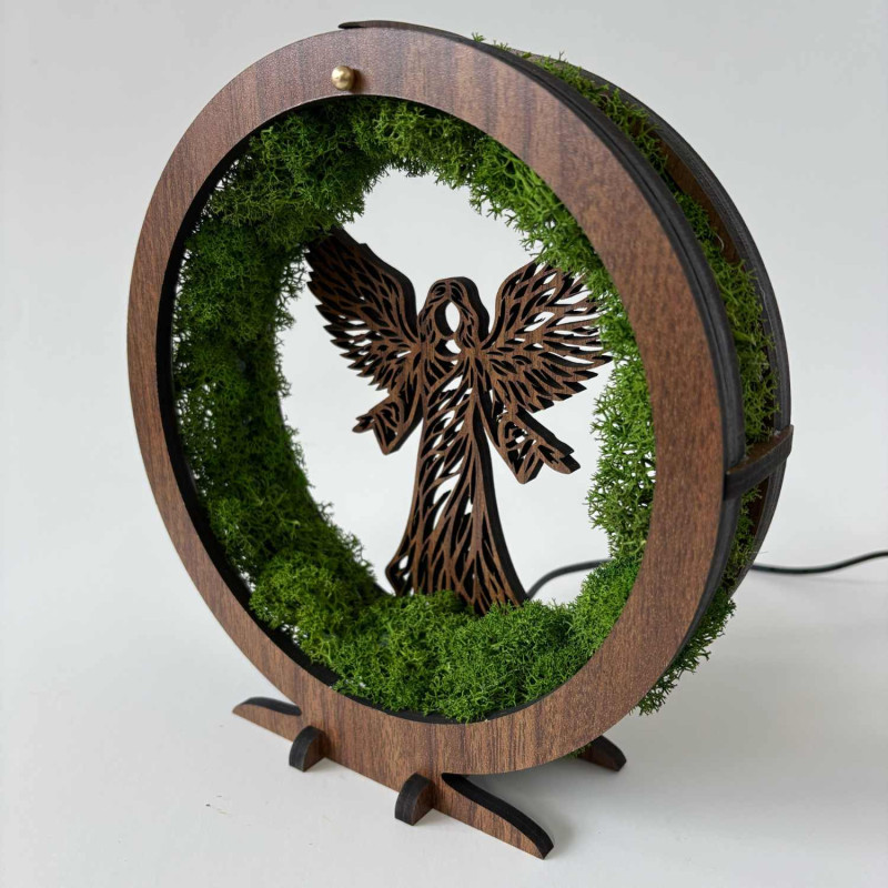 Original table decoration with angel, moss and LED lighting