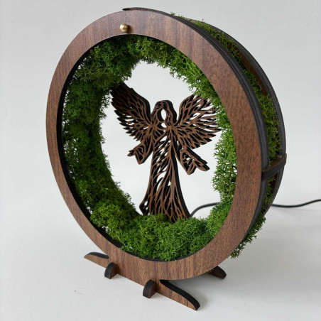 Original table decoration with angel, moss and LED lighting