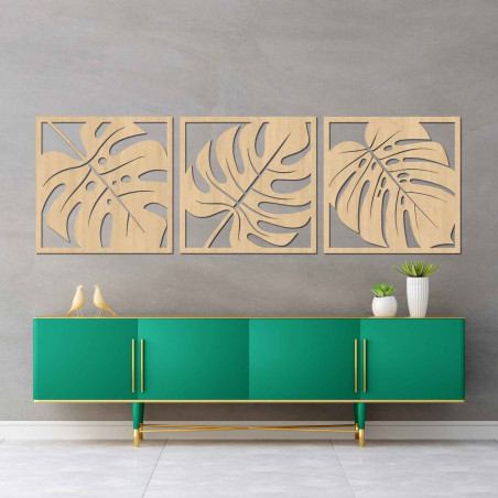 Wooden wall decoration with a tropical leaf motif in black