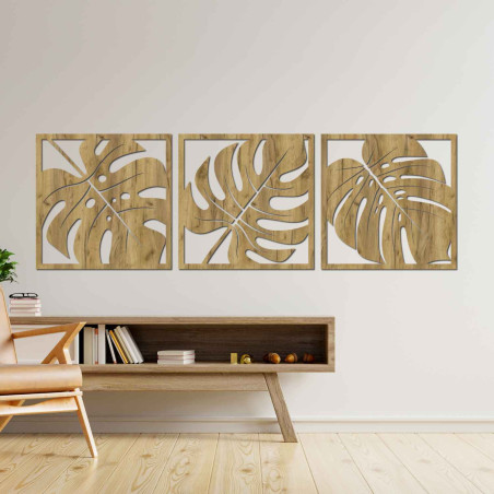 Wooden wall decoration with a tropical leaf motif in black