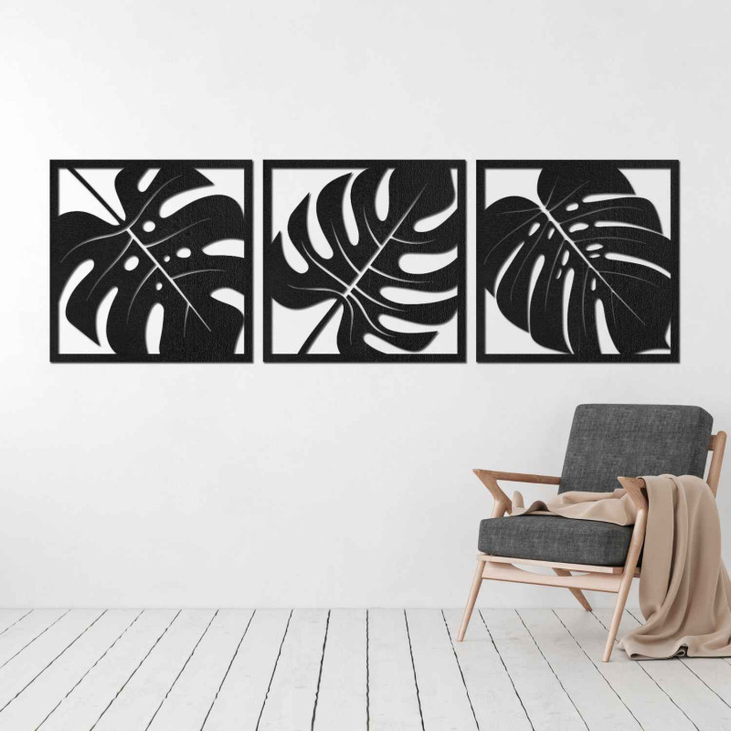 Wooden wall decoration with a tropical leaf motif in black