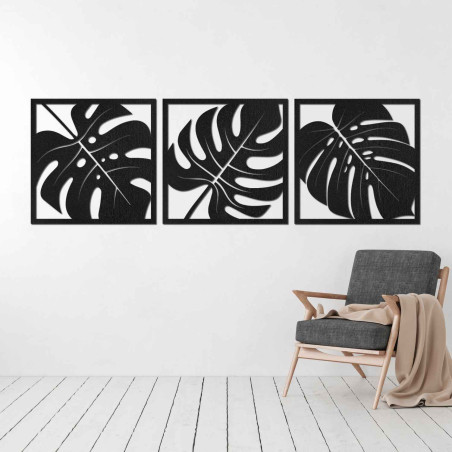 Wooden wall decoration with a tropical leaf motif in black