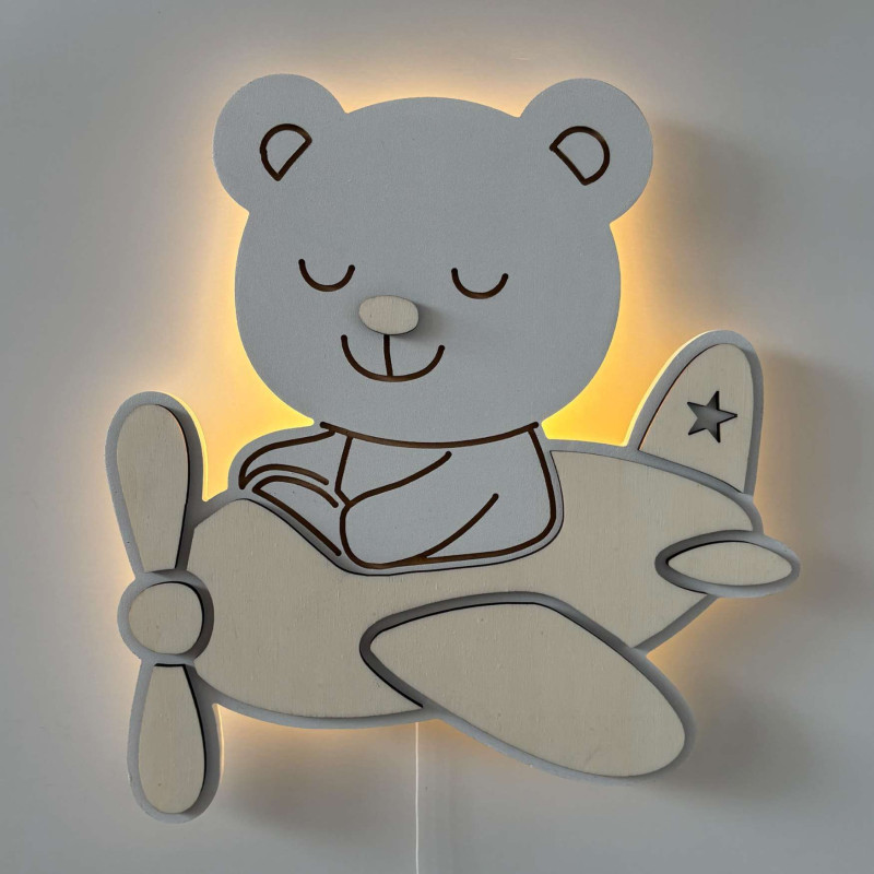 Original wooden LED lamp with an airplane and a teddy bear for a modern children's room