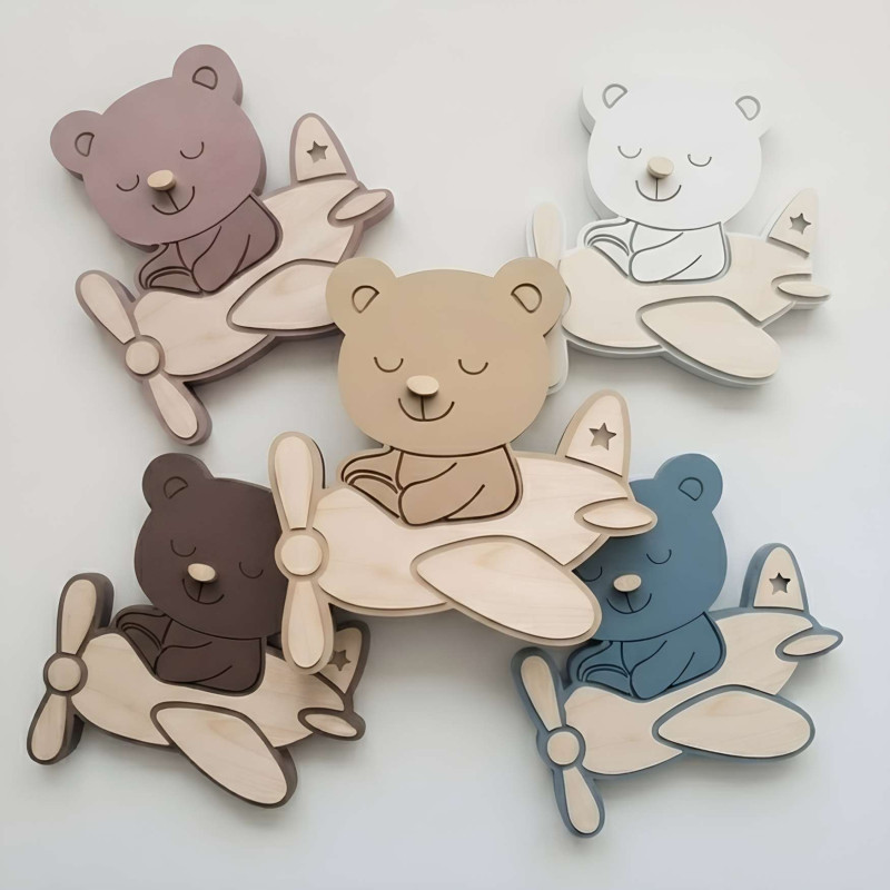 Modern LED lamp Teddy Bear in a plane as decoration and night lighting for a child's room