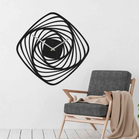 Modern wooden wall clock with a geometric spiral pattern in golden oak decor.