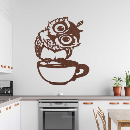 A cheerful wooden owl with coffee as a unique interior accessory